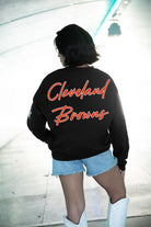 CLEVELAND BROWNS RADIANT ENERGY EMBELLISHED STAR SLEEVE CREWNECK PULLOVER IN BLACK