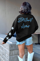 DETROIT LIONS RADIANT ENERGY EMBELLISHED STAR SLEEVE CREWNECK PULLOVER IN BLACK