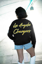 LOS ANGELES CHARGERS RADIANT ENERGY EMBELLISHED STAR SLEEVE CREWNECK PULLOVER IN BLACK