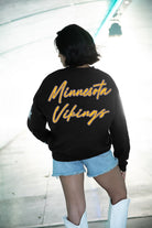 MINNESOTA VIKINGS RADIANT ENERGY EMBELLISHED STAR SLEEVE CREWNECK PULLOVER IN BLACK