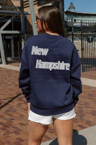 NEW HAMPSHIRE WILDCATS DEDICATION EMBELLISHED STAR SLEEVE CREWNECK PULLOVER