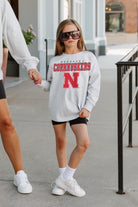 NEBRASKA CORNHUSKERS BIG GOALS KIDS DROP SHOULDER LONG SLEEVE TEE WITH RIBBED NECKLINE AND CUFFS