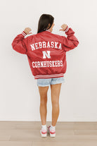 NEBRASKA CORNHUSKERS CHAMPION'S CLUB SPORT STRIPE VARSITY JACKET BY MADI PREWETT TROUTT