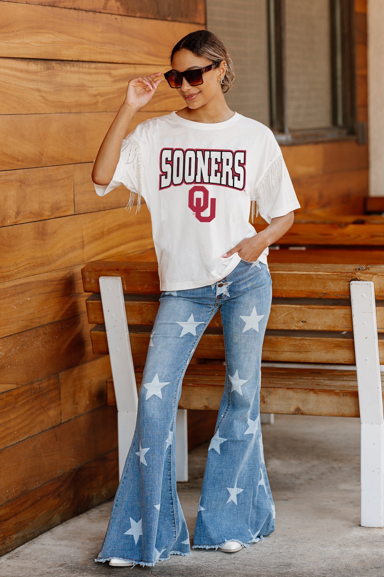 OKLAHOMA SOONERS IRRESISTIBLE SHORT SLEEVE RHINESTONE FRINGE TEE WITH RIBBED NECKLINE