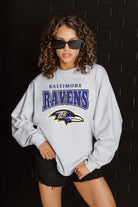 BALTIMORE RAVENS FIGHTING SPIRIT RELAXED FIT HEATHERED LONG SLEEVE FRENCH TERRY PULLOVER