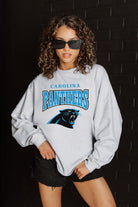 CAROLINA PANTHERS FIGHTING SPIRIT RELAXED FIT HEATHERED LONG SLEEVE FRENCH TERRY PULLOVER