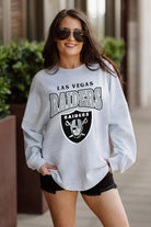 LAS VEGAS RAIDERS FIGHTING SPIRIT RELAXED FIT HEATHERED LONG SLEEVE FRENCH TERRY PULLOVER