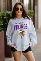 MINNESOTA VIKINGS FIGHTING SPIRIT RELAXED FIT HEATHERED LONG SLEEVE FRENCH TERRY PULLOVER