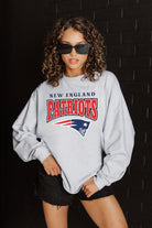 NEW ENGLAND PATRIOTS FIGHTING SPIRIT RELAXED FIT HEATHERED LONG SLEEVE FRENCH TERRY PULLOVER