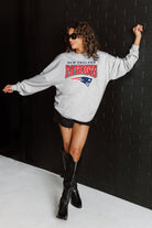 NEW ENGLAND PATRIOTS FIGHTING SPIRIT RELAXED FIT HEATHERED LONG SLEEVE FRENCH TERRY PULLOVER