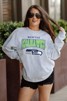 SEATTLE SEAHAWKS FIGHTING SPIRIT RELAXED FIT HEATHERED LONG SLEEVE FRENCH TERRY PULLOVER