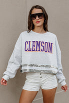 CLEMSON TIGERS PASS THE SHINE LONG SLEEVE METALLIC SHIMMER-STRIPE TOP WITH RIBBED NECKLINE AND CUFFS