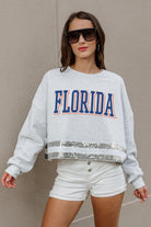 FLORIDA GATORS PASS THE SHINE LONG SLEEVE METALLIC SHIMMER-STRIPE TOP WITH RIBBED NECKLINE AND CUFFS