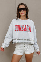 GONZAGA BULLDOGS PASS THE SHINE LONG SLEEVE METALLIC SHIMMER-STRIPE TOP WITH RIBBED NECKLINE AND CUFFS