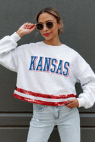 KANSAS JAYHAWKS PASS THE SHINE LONG SLEEVE METALLIC SHIMMER-STRIPE TOP WITH RIBBED NECKLINE AND CUFFS