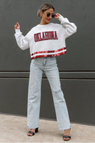 OKLAHOMA SOONERS PASS THE SHINE LONG SLEEVE METALLIC SHIMMER-STRIPE TOP WITH RIBBED NECKLINE AND CUFFS