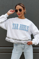 NORTH CAROLINA TAR HEELS PASS THE SHINE LONG SLEEVE METALLIC SHIMMER-STRIPE TOP WITH RIBBED NECKLINE AND CUFFS