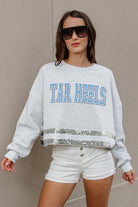 NORTH CAROLINA TAR HEELS PASS THE SHINE LONG SLEEVE METALLIC SHIMMER-STRIPE TOP WITH RIBBED NECKLINE AND CUFFS