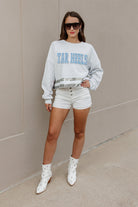 NORTH CAROLINA TAR HEELS PASS THE SHINE LONG SLEEVE METALLIC SHIMMER-STRIPE TOP WITH RIBBED NECKLINE AND CUFFS