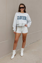 XAVIER MUSKETEERS PASS THE SHINE LONG SLEEVE METALLIC SHIMMER-STRIPE TOP WITH RIBBED NECKLINE AND CUFFS