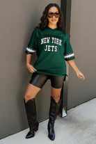 NEW YORK JETS UNTIL KICKOFF OVERSIZED V-NECK RHINESTONE-STRIPED TRIM FASHION TOP