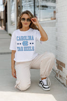 NORTH CAROLINA TAR HEELS TO THE POINT BOXY FIT WOMEN'S CROP TEE