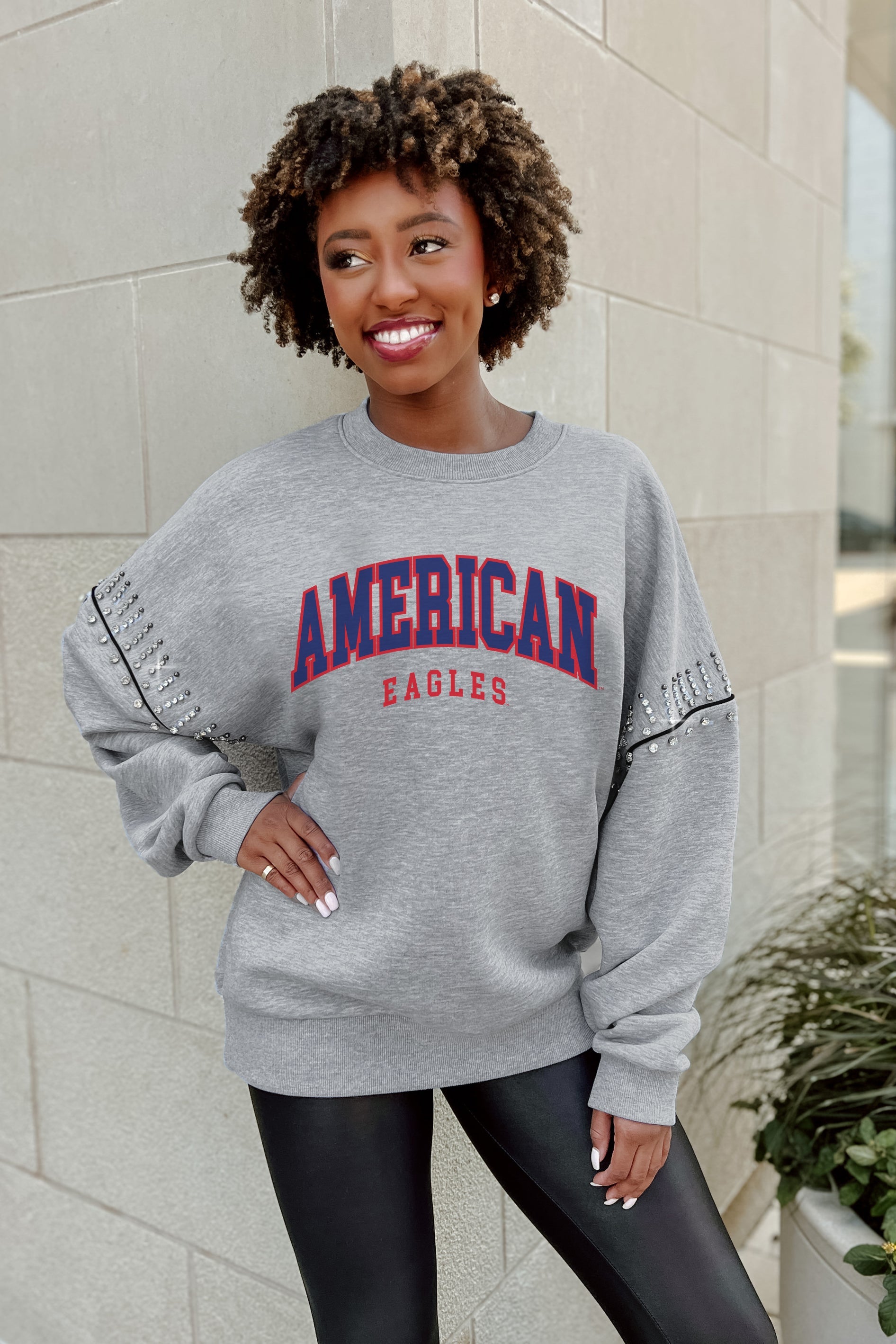 AMERICAN UNIVERSITY EAGLES COMPETITIVE EDGE FLEECE PULLOVER WITH JEWEL SLEEVE EMBELLISHMENTS