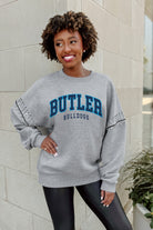 BUTLER BULLDOGS COMPETITIVE EDGE FLEECE PULLOVER WITH JEWEL SLEEVE EMBELLISHMENTS