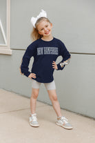 NEW HAMPSHIRE WILDCATS GUESS WHO'S BACK KIDS SEQUIN YOKE PULLOVER