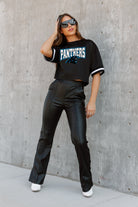 CAROLINA PANTHERS AUTOMATIC DOWN LIGHTWEIGHT SPORTY TOP WITH STRIPED SLEEVE DETAIL