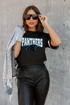 CAROLINA PANTHERS AUTOMATIC DOWN LIGHTWEIGHT SPORTY TOP WITH STRIPED SLEEVE DETAIL