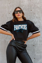 CAROLINA PANTHERS AUTOMATIC DOWN LIGHTWEIGHT SPORTY TOP WITH STRIPED SLEEVE DETAIL