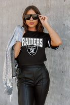 LAS VEGAS RAIDERS AUTOMATIC DOWN LIGHTWEIGHT SPORTY TOP WITH STRIPED SLEEVE DETAIL