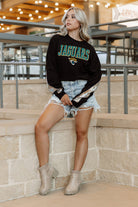 JACKSONVILLE JAGUARS GAMEDAY GLITZ LONG SLEEVE TEE WITH SEQUIN TRIM BACK AND SLEEVE DETAIL